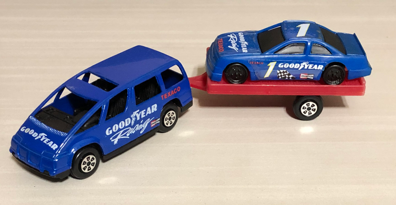 A racing sponsored dustbuster hauling racing sponsored racing car for racing? Sign me up